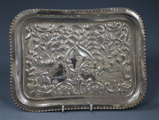 A late Victorian repousse silver dressing table tray, London, 1891, 26cm.